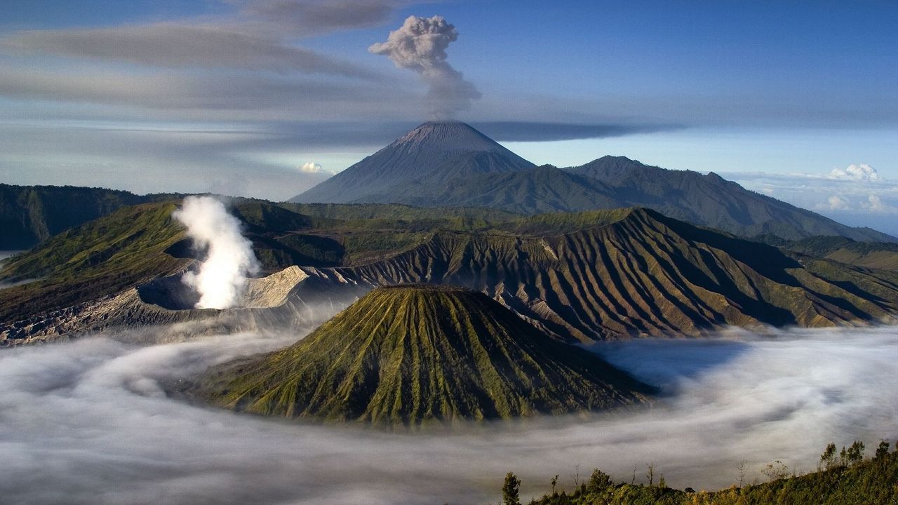A volcanic black sand beach with clear blue water in the Canary Islands